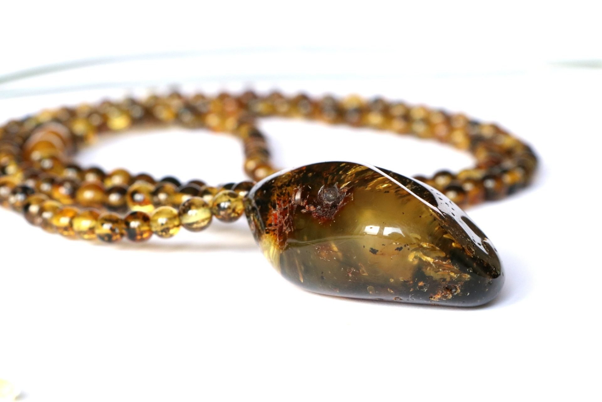 Green color long amber necklace with pendant N251